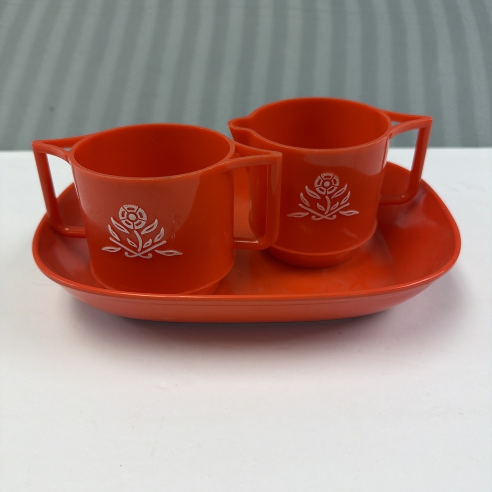 Vintage Orange Plastic sugar and creamer with floral design And Tray